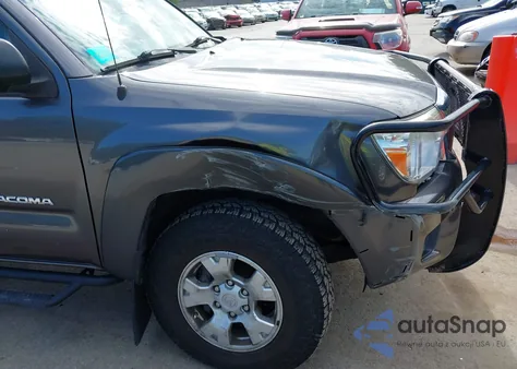 2015 Toyota Tacoma Base V6 z USA, uszkodzony, nr VIN 5TFUU4EN8FX146499